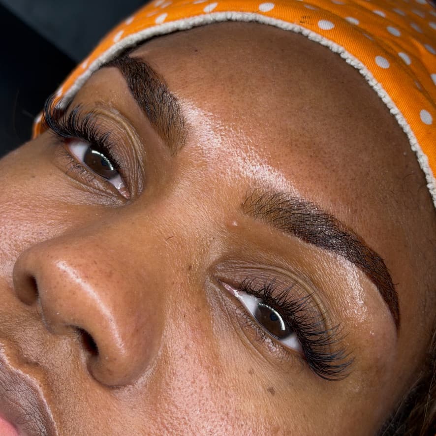 Hybrid volume lash extensions with shaped arched brows